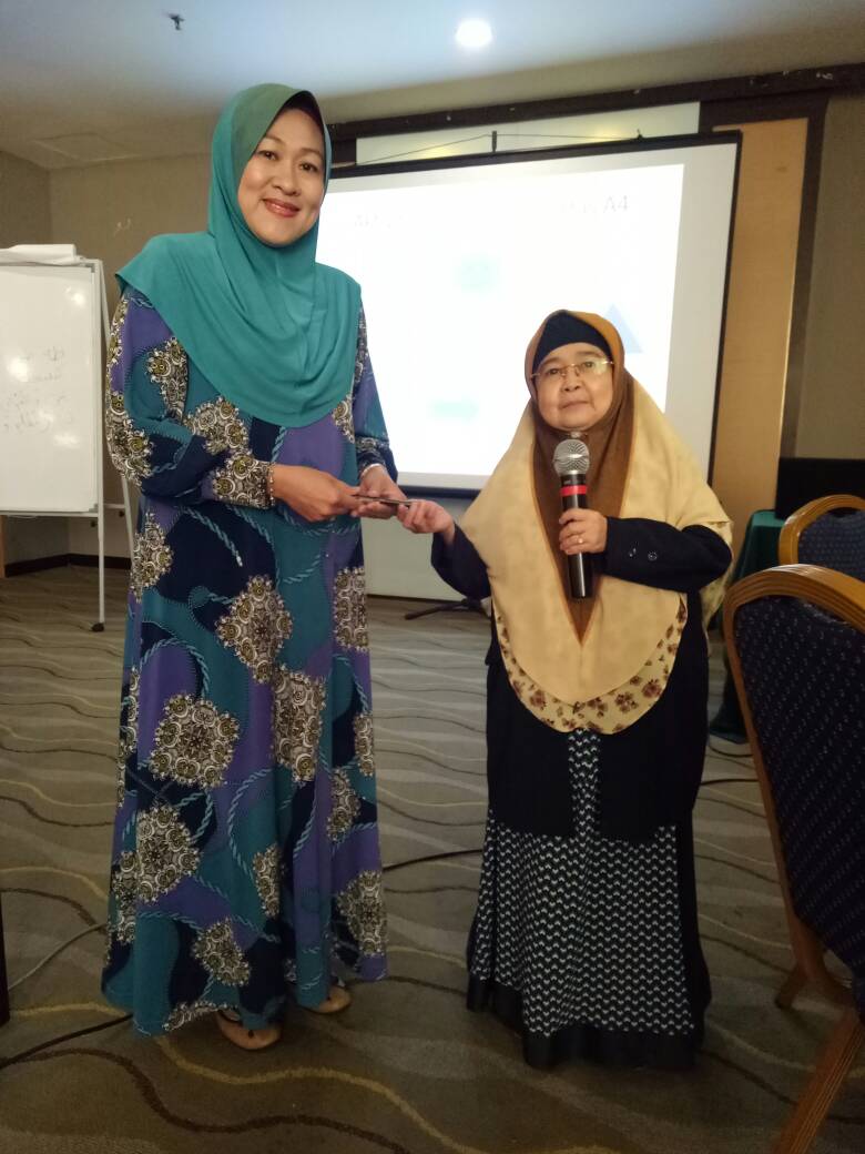 Ruziah with a participant who attended one of her talks.